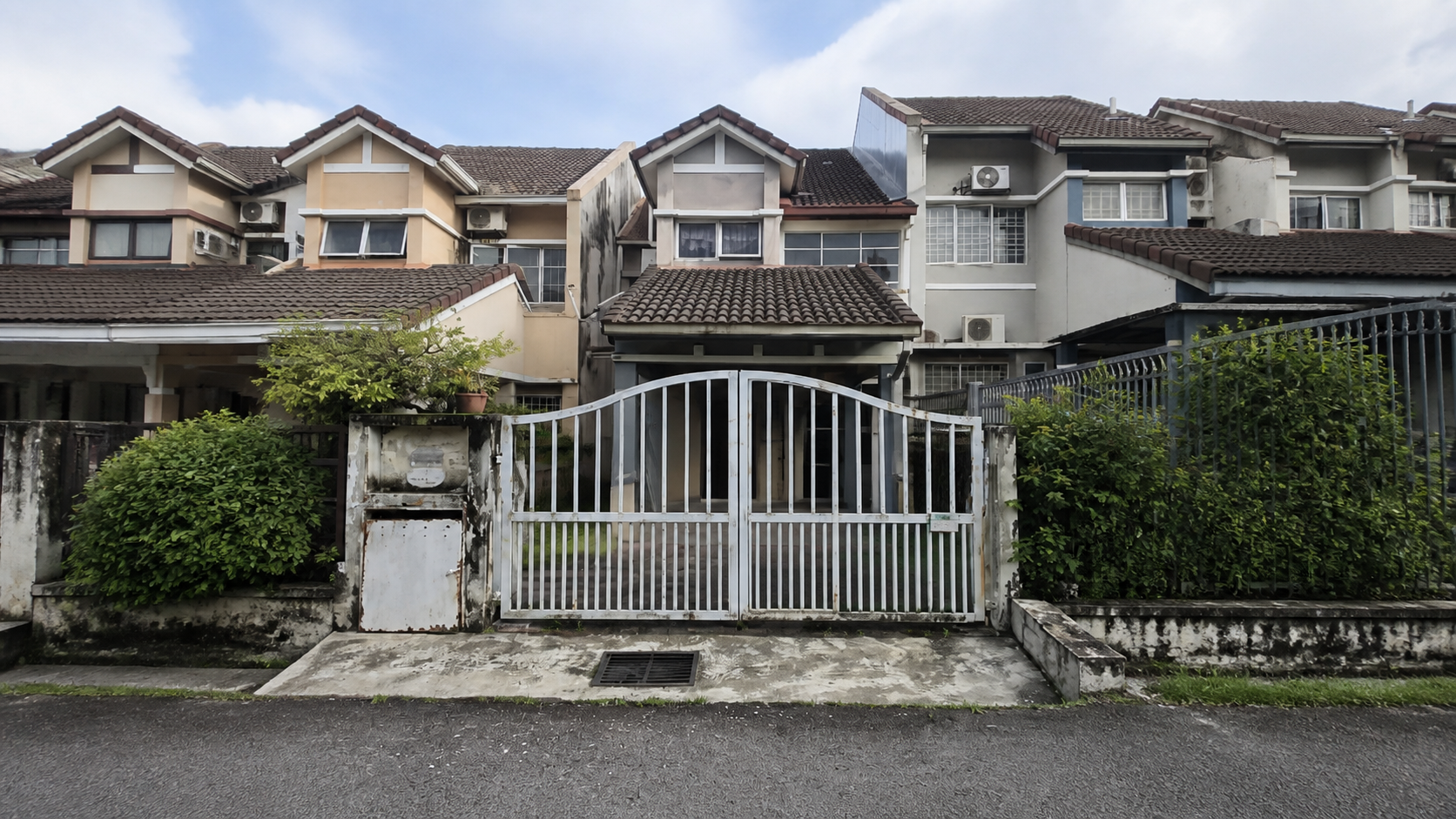 Exterior of the same Malaysian terrace house before renovation